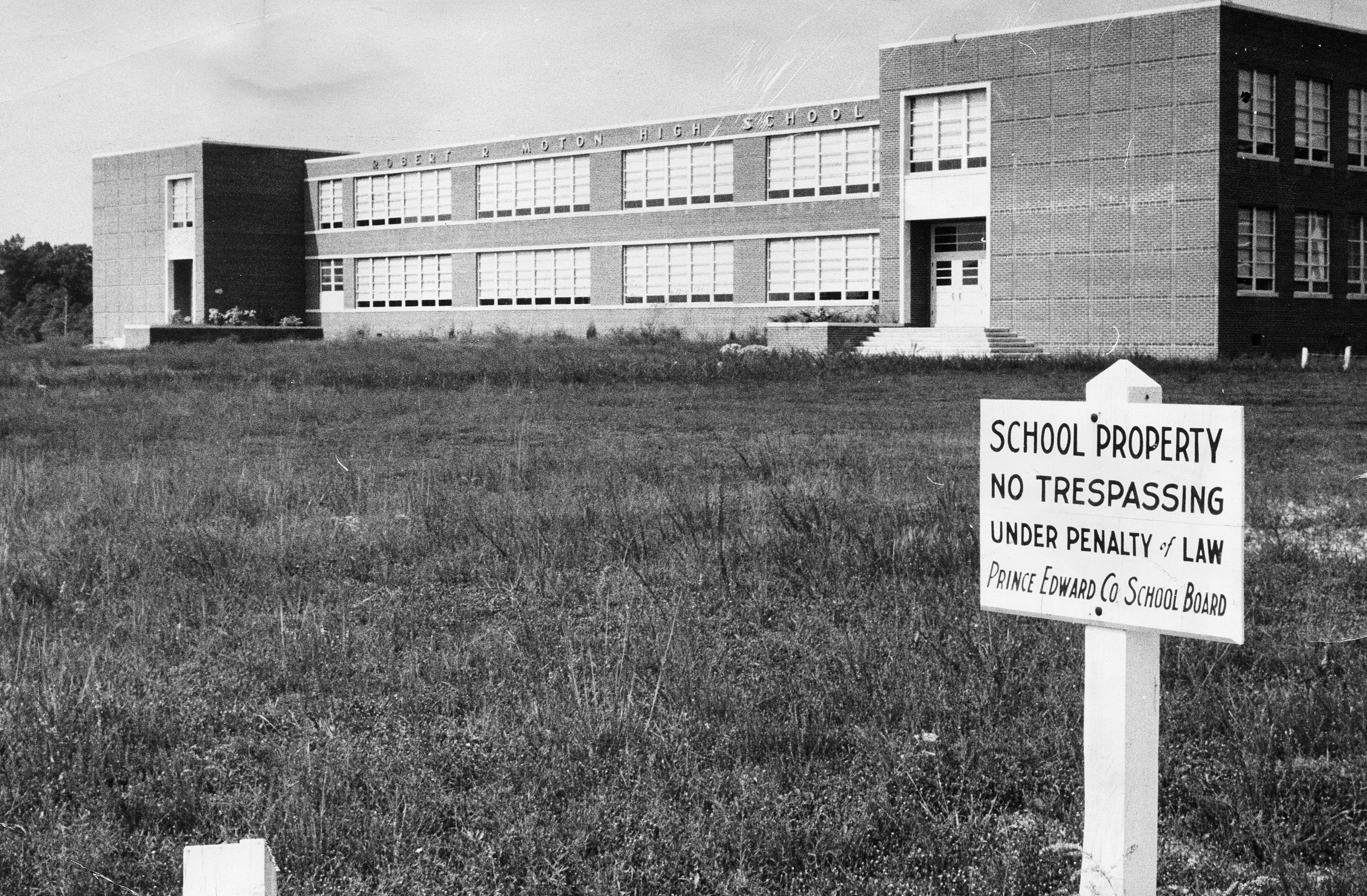 An image of the community center with a no trespassing sign posted out front by order of Prince Edward County