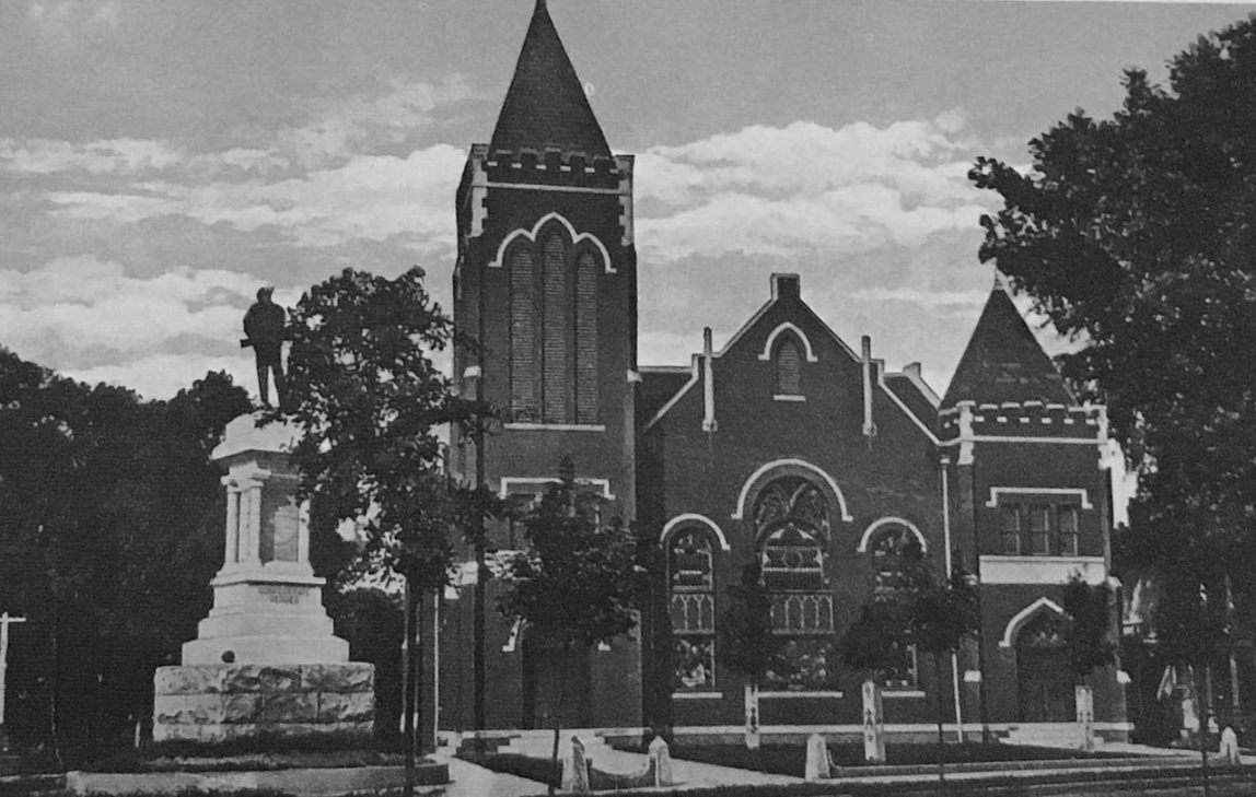 A historical image of the methodist church and the Confederate statue in the foreground